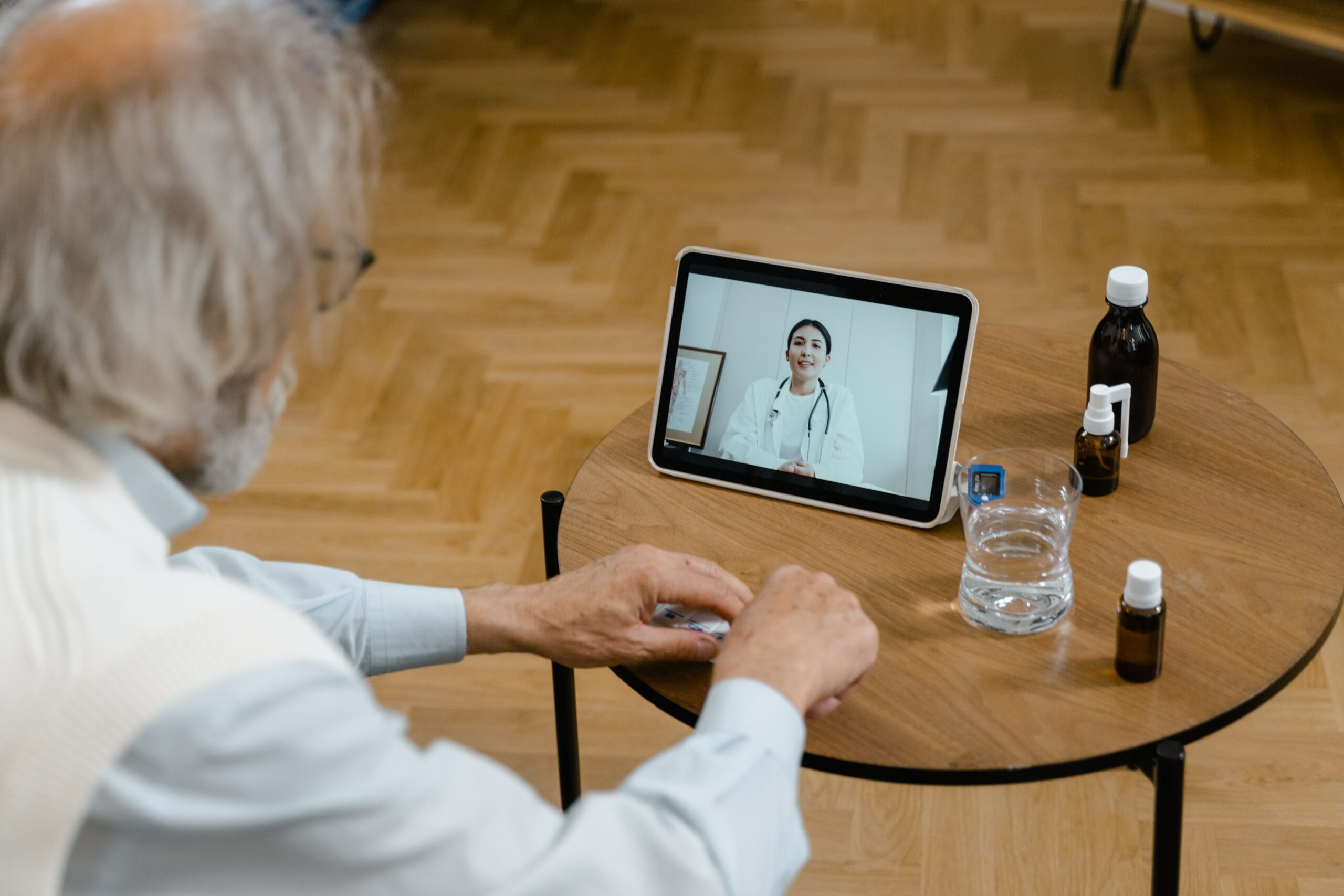 physician using technology to meet with a patient